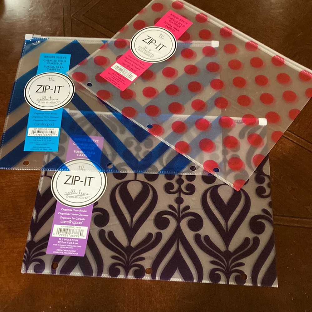 Set of three Zip It Collection binder sleeve/organizers. Pink, blue and purple.